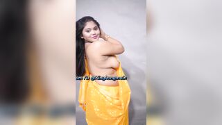 Sexy model strip her yellow saree and showing big boobs