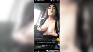 Girl pressed her big boobs while sitting inside the car